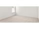 Bright bedroom featuring neutral carpet and a window at 6125 Village Edge Pl, Sanford, FL 32771