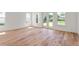 Bright bedroom with beautiful hardwood floors and large windows providing ample natural light at 6125 Village Edge Pl, Sanford, FL 32771