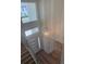 High-ceiling entryway with chandelier lighting, designer walls, and staircase with modern banister at 6125 Village Edge Pl, Sanford, FL 32771