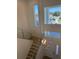 Bright two-story foyer with modern lighting and staircase at 6125 Village Edge Pl, Sanford, FL 32771