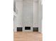 Living room featuring a modern fireplace with gray tile surround and custom cabinets at 6125 Village Edge Pl, Sanford, FL 32771