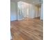 Foyer features stunning wood floors, staircase and modern wall design at 6125 Village Edge Pl, Sanford, FL 32771