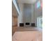 Spacious living room with a fireplace, hardwood floors, and open to the kitchen at 6125 Village Edge Pl, Sanford, FL 32771