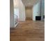 Spacious living room features hardwood floors, a fireplace, and contemporary design at 6125 Village Edge Pl, Sanford, FL 32771