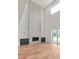 Living room showcases a fireplace, high ceilings, and a sliding glass door at 6125 Village Edge Pl, Sanford, FL 32771
