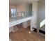 Open-concept living space with fireplace, glass railings, and hardwood floors at 6125 Village Edge Pl, Sanford, FL 32771