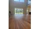 Spacious living area with hardwood floors, fireplace, and seamless access to the outdoor space at 6125 Village Edge Pl, Sanford, FL 32771
