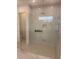 Modern walk-in shower with glass enclosure, rainfall showerhead, and tiled walls for a spa-like feel at 6125 Village Edge Pl, Sanford, FL 32771