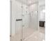 Spacious shower with glass enclosure, rain shower head, and modern fixtures at 6125 Village Edge Pl, Sanford, FL 32771