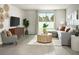 Inviting living room with wood-look flooring, comfortable seating, and sliding glass doors to the backyard at 674 Pennywort St, Lake Alfred, FL 33850