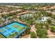Aerial view of community amenities including tennis courts, pools, and lush landscaping in a vibrant neighborhood setting at 7041 Oakwood St, Davenport, FL 33837