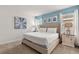 Comfortable bedroom featuring a king bed, soothing color palette and tasteful decor for relaxation at 7041 Oakwood St, Davenport, FL 33837