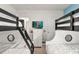 bedroom with two bunk beds and a Little Mermaid themed wall mural at 7041 Oakwood St, Davenport, FL 33837