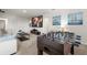 Spacious game room with foosball table, large screen and comfortable seating for entertainment and relaxation at 7041 Oakwood St, Davenport, FL 33837