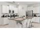 Well-equipped kitchen with granite countertops, stainless steel appliances, and a breakfast bar at 7041 Oakwood St, Davenport, FL 33837