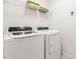 Well-equipped laundry room with modern appliances, including a washer and dryer, for convenient laundry care at 7041 Oakwood St, Davenport, FL 33837