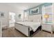 Bright main bedroom with plush carpeting and ample natural light at 7041 Oakwood St, Davenport, FL 33837