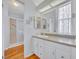 Bright bathroom featuring white cabinetry, a granite countertop, and a glass-enclosed shower at 750 Polo Park Blvd, Davenport, FL 33897