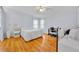 Serene bedroom featuring wood floors and natural light at 750 Polo Park Blvd, Davenport, FL 33897