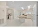 Bright kitchen with an island and a convenient desk area, perfect for a home office at 750 Polo Park Blvd, Davenport, FL 33897