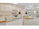 Functional kitchen boasts plenty of cabinet space and a center island, ready for cooking at 750 Polo Park Blvd, Davenport, FL 33897