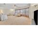 Bright living room with carpeted floors and large windows at 750 Polo Park Blvd, Davenport, FL 33897
