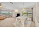 Open-concept dining and living area with a chandelier and lots of natural light at 750 Polo Park Blvd, Davenport, FL 33897