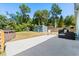Spacious backyard with mature trees, a shed, patio furniture and a swimming pool at 793 Greenway Pl, Daytona Beach, FL 32114