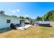 Spacious backyard features a patio, above ground pool, boat, and mature landscaping at 793 Greenway Pl, Daytona Beach, FL 32114