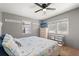 Bright bedroom with a queen bed, dual windows, and a beach-themed quilt at 793 Greenway Pl, Daytona Beach, FL 32114