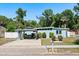 Charming single-story home with a covered outdoor seating area and well-maintained landscaping at 793 Greenway Pl, Daytona Beach, FL 32114