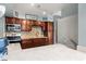 Kitchen with a microwave, dark wood cabinets, stainless steel appliances, and light countertops at 793 Greenway Pl, Daytona Beach, FL 32114