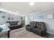 Inviting living room featuring gray wood floors, comfortable seating, and stylish decor at 793 Greenway Pl, Daytona Beach, FL 32114