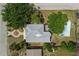 An aerial view reveals this home's roof, landscaping and proximity to other residences in the neighborhood at 803 Jersey Ave, St Cloud, FL 34769