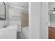 Well-lit bathroom with a shower-tub combo at 803 Jersey Ave, St Cloud, FL 34769