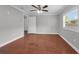 Bright bedroom with a ceiling fan and a large window at 803 Jersey Ave, St Cloud, FL 34769