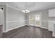 An inviting dining room with wainscoting, modern lighting and access to the outdoor patio at 803 Jersey Ave, St Cloud, FL 34769