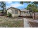 Charming home with backyard sunroom and lush landscaping at 803 Jersey Ave, St Cloud, FL 34769