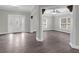 Spacious foyer featuring modern flooring, fresh paint, and an elegant front door with decorative glass at 803 Jersey Ave, St Cloud, FL 34769