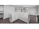 Spacious open-concept kitchen with white cabinets, a center island, and modern appliances at 803 Jersey Ave, St Cloud, FL 34769