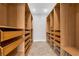 Spacious walk-in closet with custom shelving and storage solutions at 803 Jersey Ave, St Cloud, FL 34769