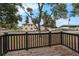 A charming home with a yard seen from the porch, enhanced by the shade of trees at 803 Jersey Ave, St Cloud, FL 34769