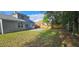 View of the backyard featuring a patio, a grassy area, mature trees and a wooden fence at 8612 Valley Ridge Ct, Orlando, FL 32818