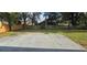 Spacious backyard with large concrete patio, grassy area, and a wood fence for privacy at 8612 Valley Ridge Ct, Orlando, FL 32818