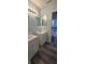 Bathroom features a double vanity and modern lighting at 8612 Valley Ridge Ct, Orlando, FL 32818