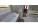 Bathroom features a jacuzzi tub, glass shower, and updated marble vanity at 8612 Valley Ridge Ct, Orlando, FL 32818