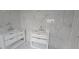 Updated bathroom features double marble vanities and tiled floors at 8612 Valley Ridge Ct, Orlando, FL 32818