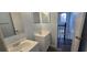 Upstairs bathroom with double vanity and staircase view at 8612 Valley Ridge Ct, Orlando, FL 32818