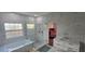 Modern bathroom features a soaking tub, glass enclosed shower, and updated vanity at 8612 Valley Ridge Ct, Orlando, FL 32818