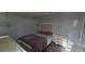 Bedroom with wood floors, a dresser, and a bed at 8612 Valley Ridge Ct, Orlando, FL 32818